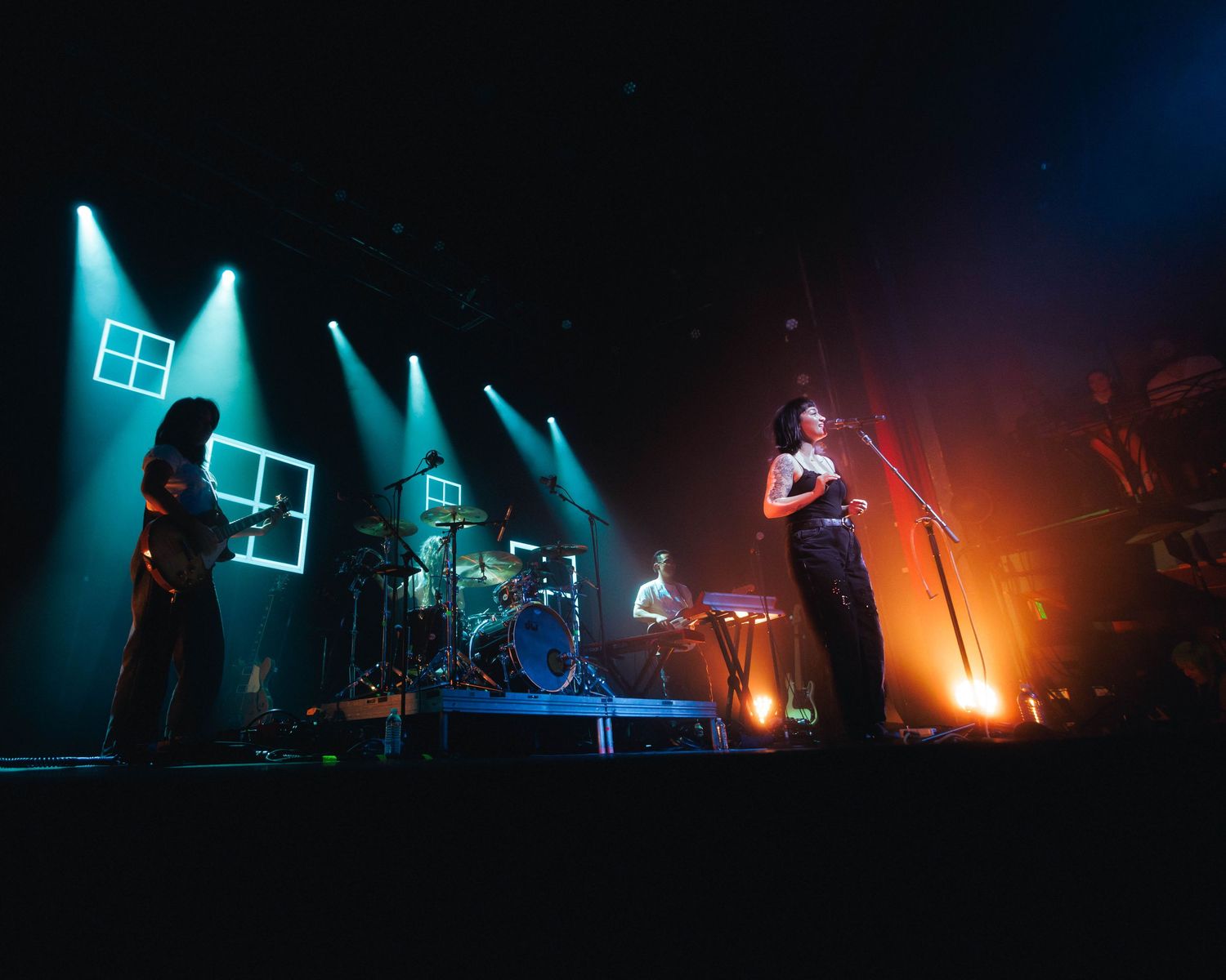 Wide angle shot of mxmtoon performing opening song on stage at Gothic Theater in Denver, Colorado during her Liminal Space Tour