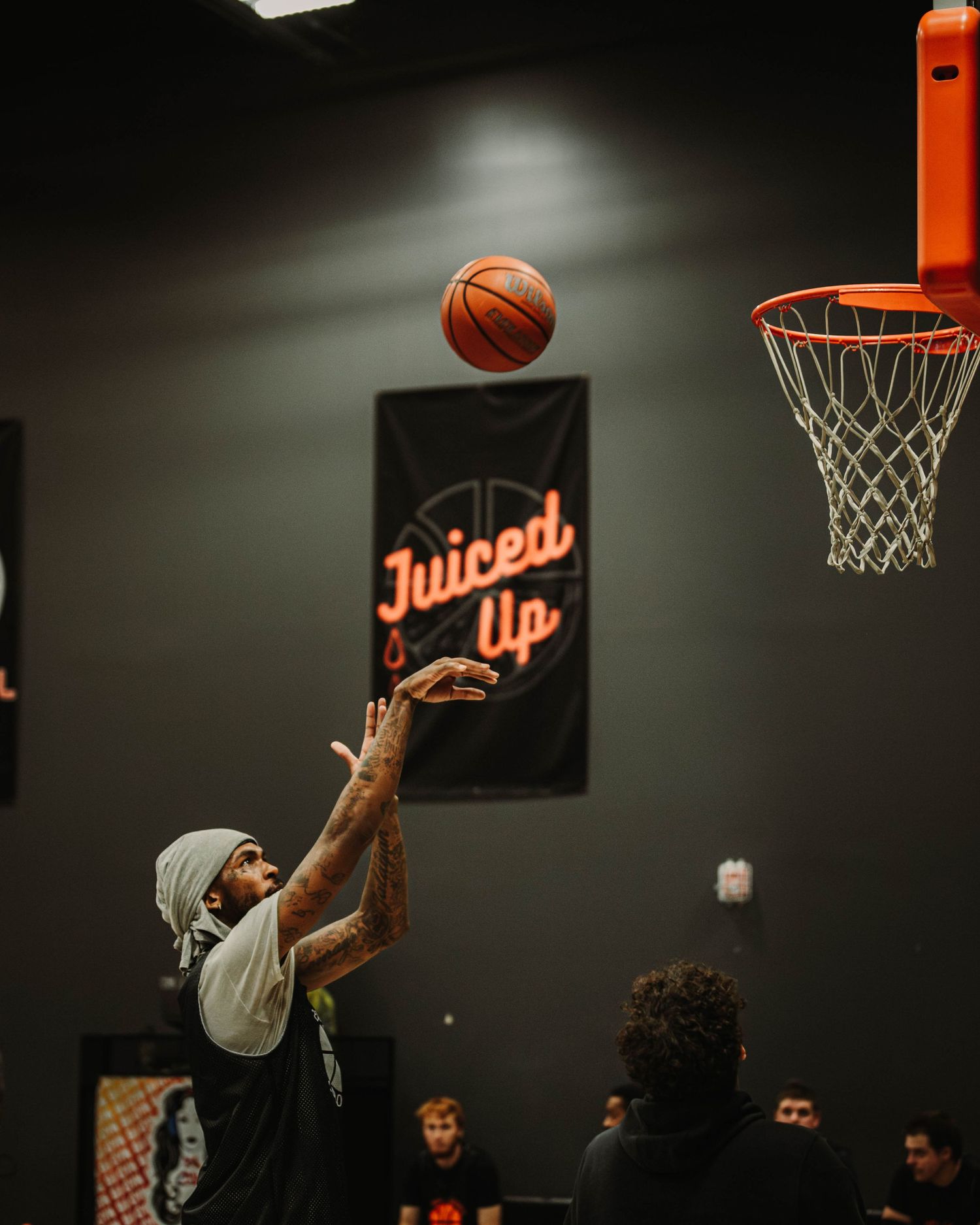 Player shooting a basketball during pregame warm ups at Basketball Social House
