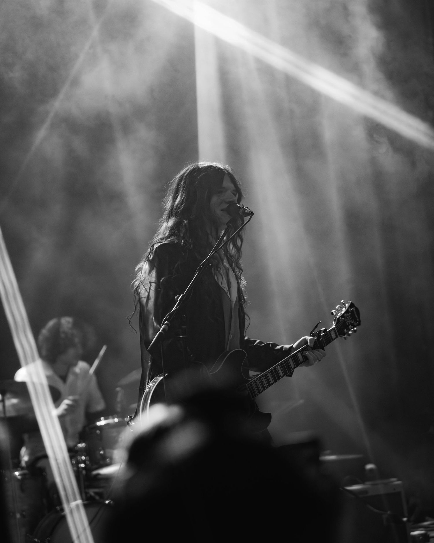 Black and white Shot from the crowd of Sawyer Hill, performing at Bluebird Theater in Denver, Colorado