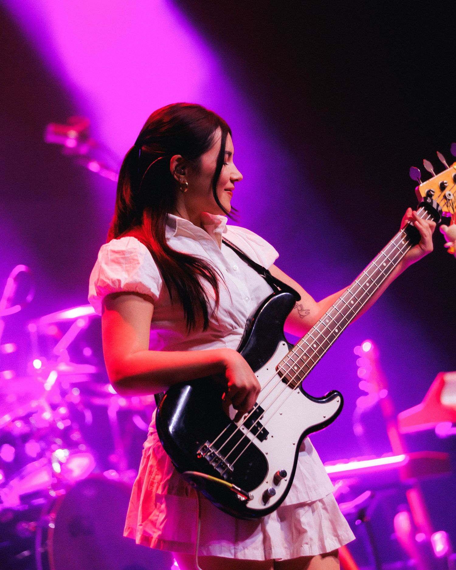 Medium shot of bassist @alinasloan performing for Juliet Ivy in the opening act of mxmtoon Liminal Space tour at Gothic Theater