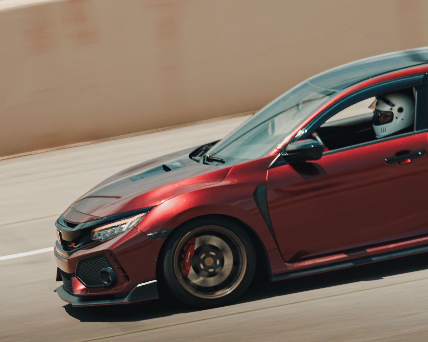 Maroon FK8 Civic Type R, speeding around PPIR, Pikes Peak International Raceway, at Down To Earth DTE Ascend