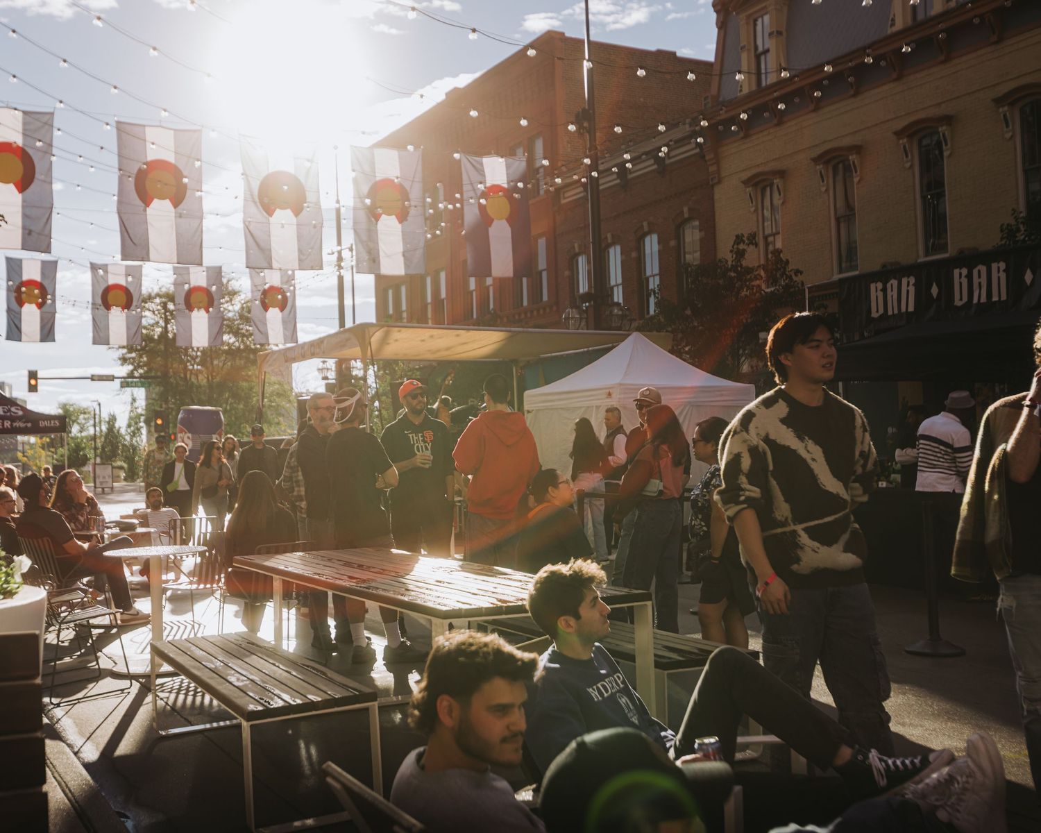 Candid group of people, walking around, enjoying their time at Beer Block in Larimer Square, Downtown Denver