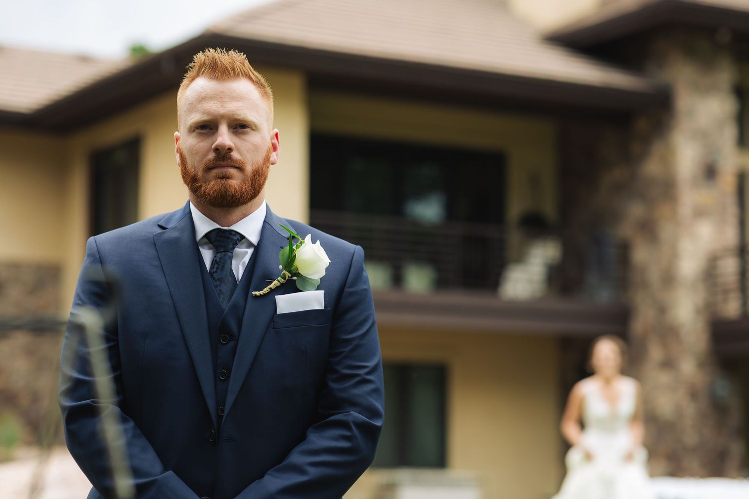 Wolfe Wedding in Franktown, Colorado, groom standing and posing, waiting for the first look of his bride.