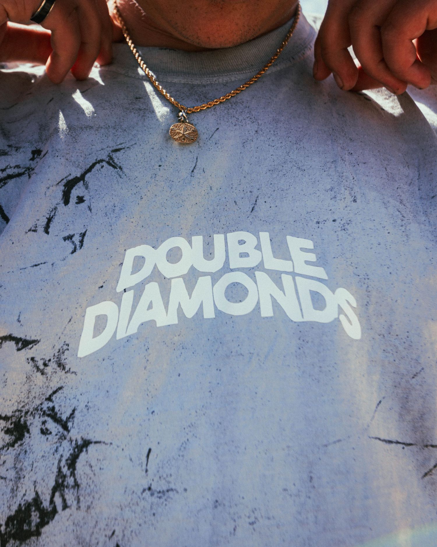 Branded photoshoot session, Close up of branded T-Shirt from Double Diamonds clothing brand