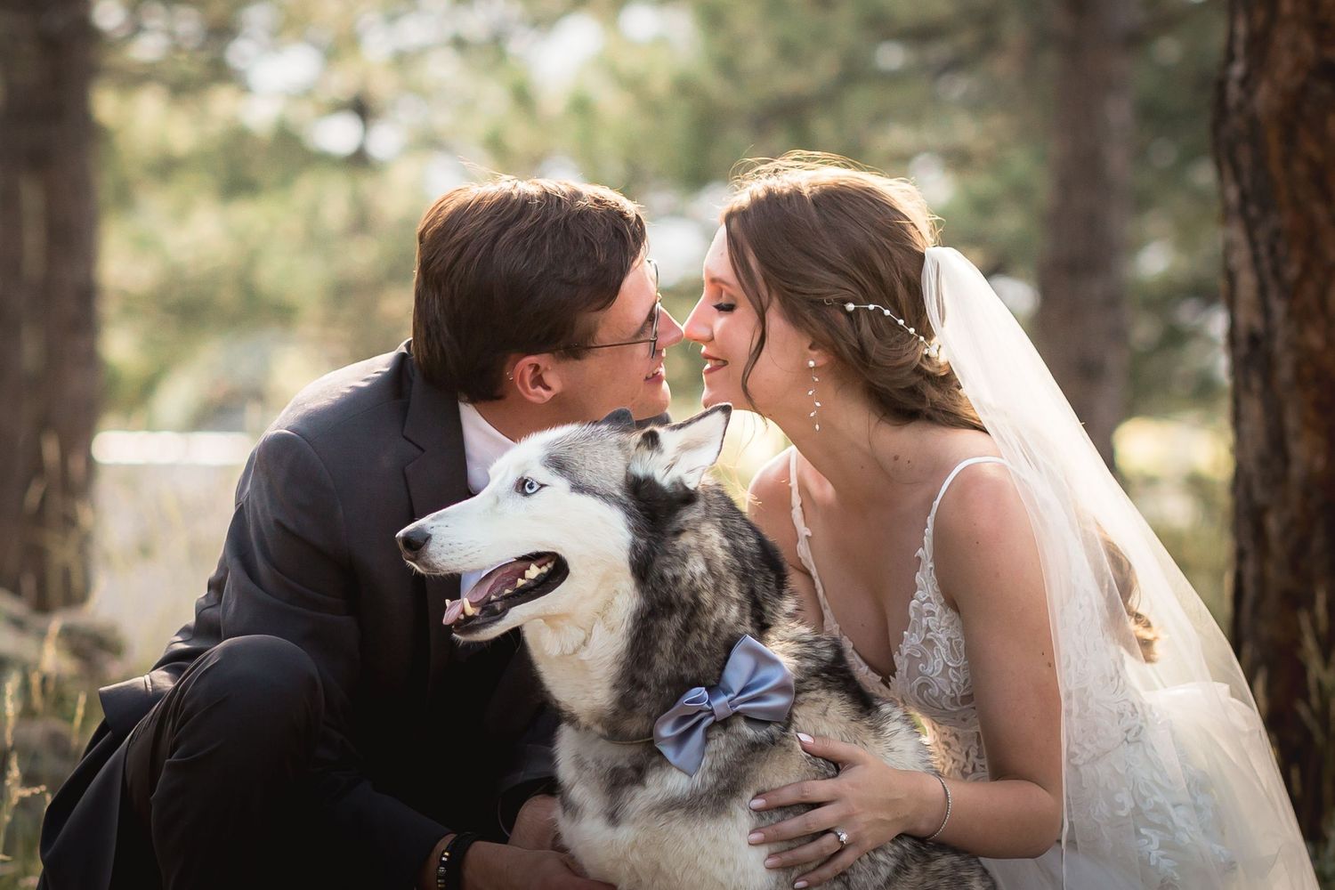 Krause Wedding, bride and groom posing for wedding photos with their dog at Botecher Mansion, in Colorado