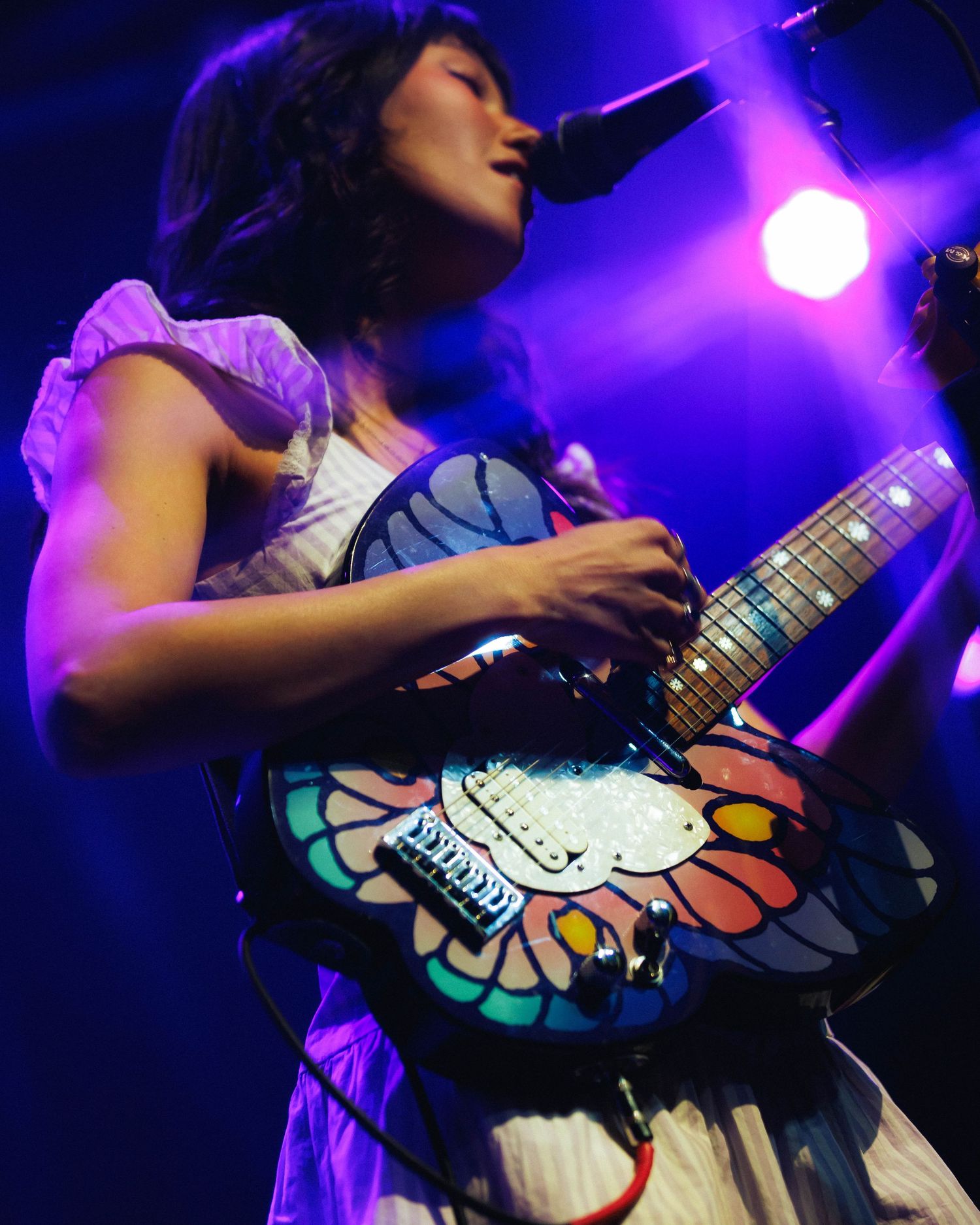 Close up of Juliet Ivy's iconic butterfly guitar while opening for mxmtoon on the Liminal Space Tour