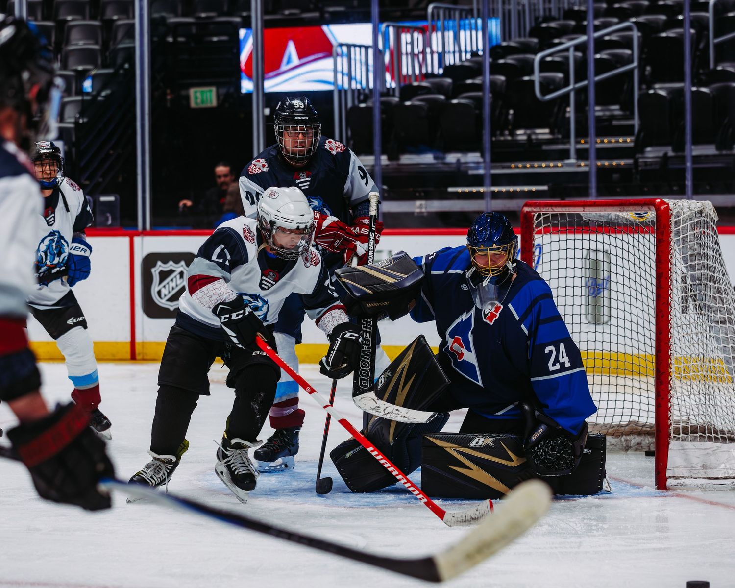 Close up of goalie defending on the ice during the Pucks For Autism x Goalie Guild game at Ball Arena in Denver Colorado