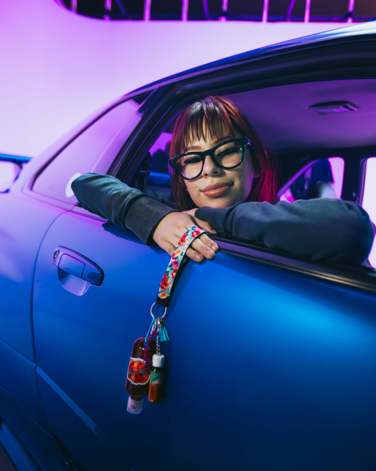 Model in an Nissan Skyline GTR R34, posing during a Y2K Car Meet Event at CoCo Event Group's Creator Meer up, promoting Treats by Dulce