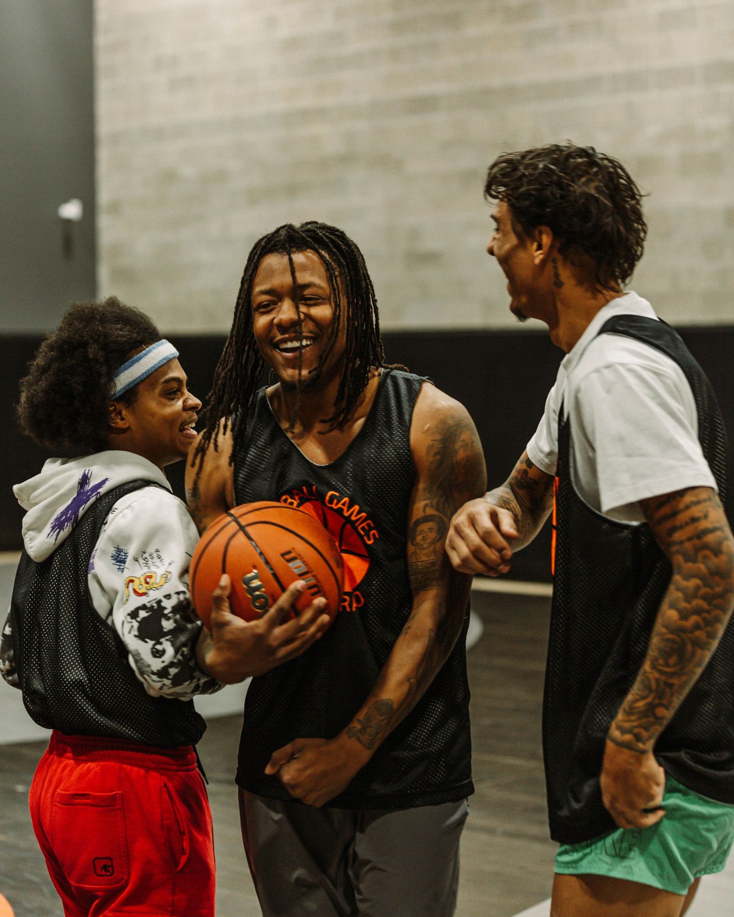 Candid post game photo of players laughing, and having a good time together