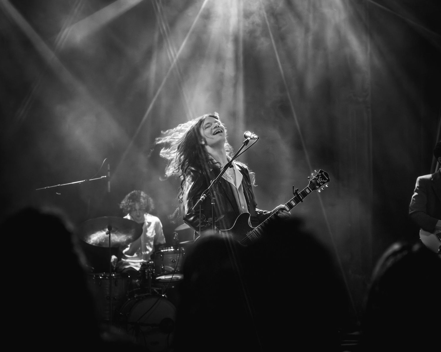 Black and white Shot from the crowd of Sawyer Hill, performing at Bluebird Theater in Denver, Colorado