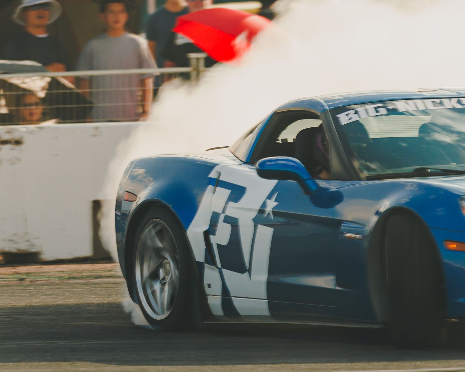 Blue C6 Corvette, drifting at Down To Earth Movement Ascend event at Pikes Peak International Raceway, PPIR, Colorado Springs, during sunset