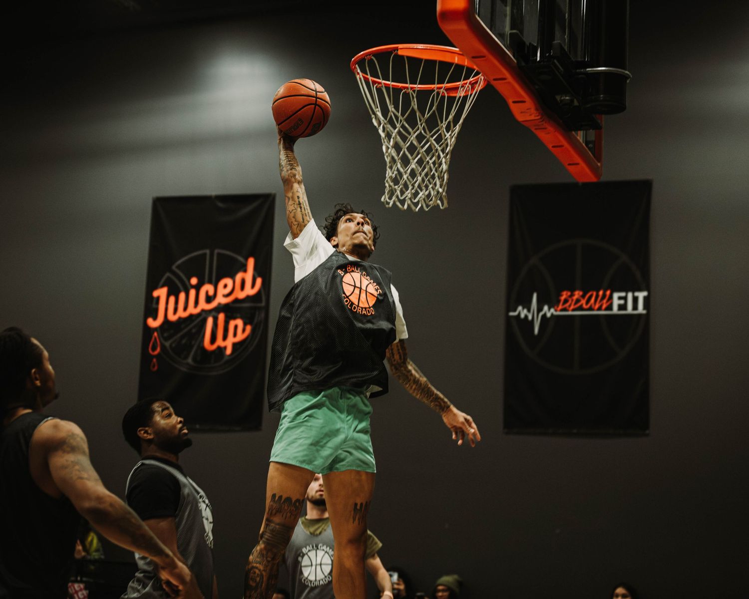 Player dunking a basketball during a game at Basketball Social House, COCO Event Group's Jam Fest