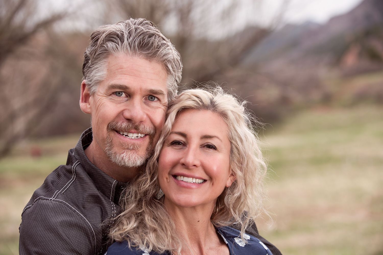 Smiling couple during an outdoor portrait session in Colorado Springs.