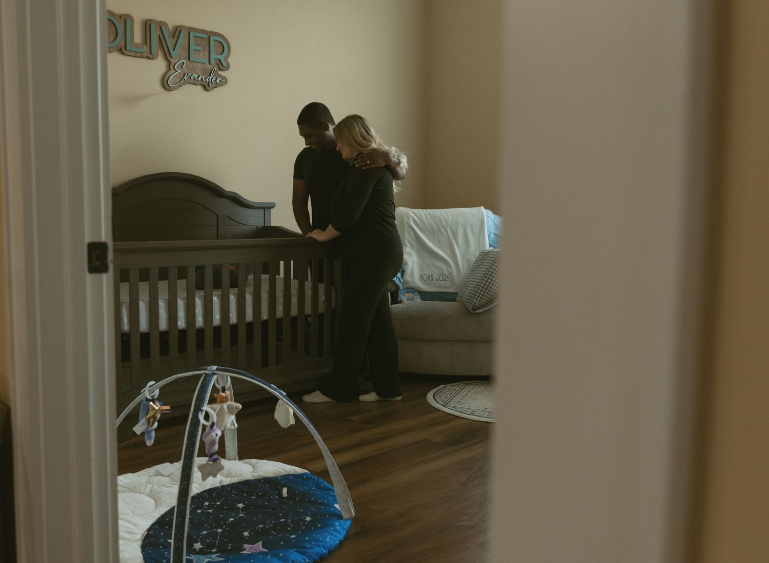Newborn in-home photo in Catskill Mountains, New York. Emotional imagery, candid details of newborn baby in nursery as he is welcomed home.