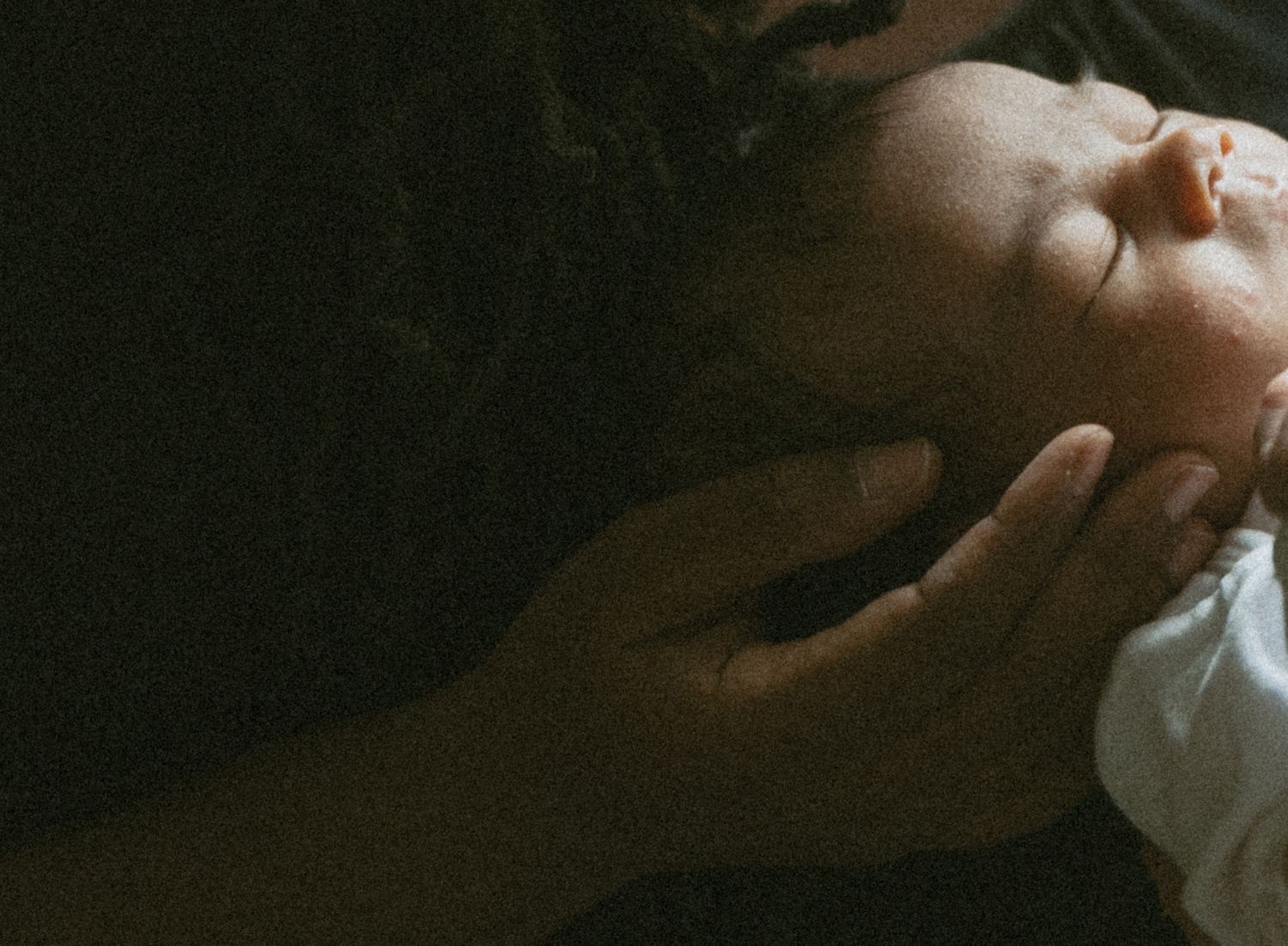 Newborn in-home photo in Catskill Mountains, New York. Emotional imagery, candid details of newborn baby in nursery as he is welcomed home.