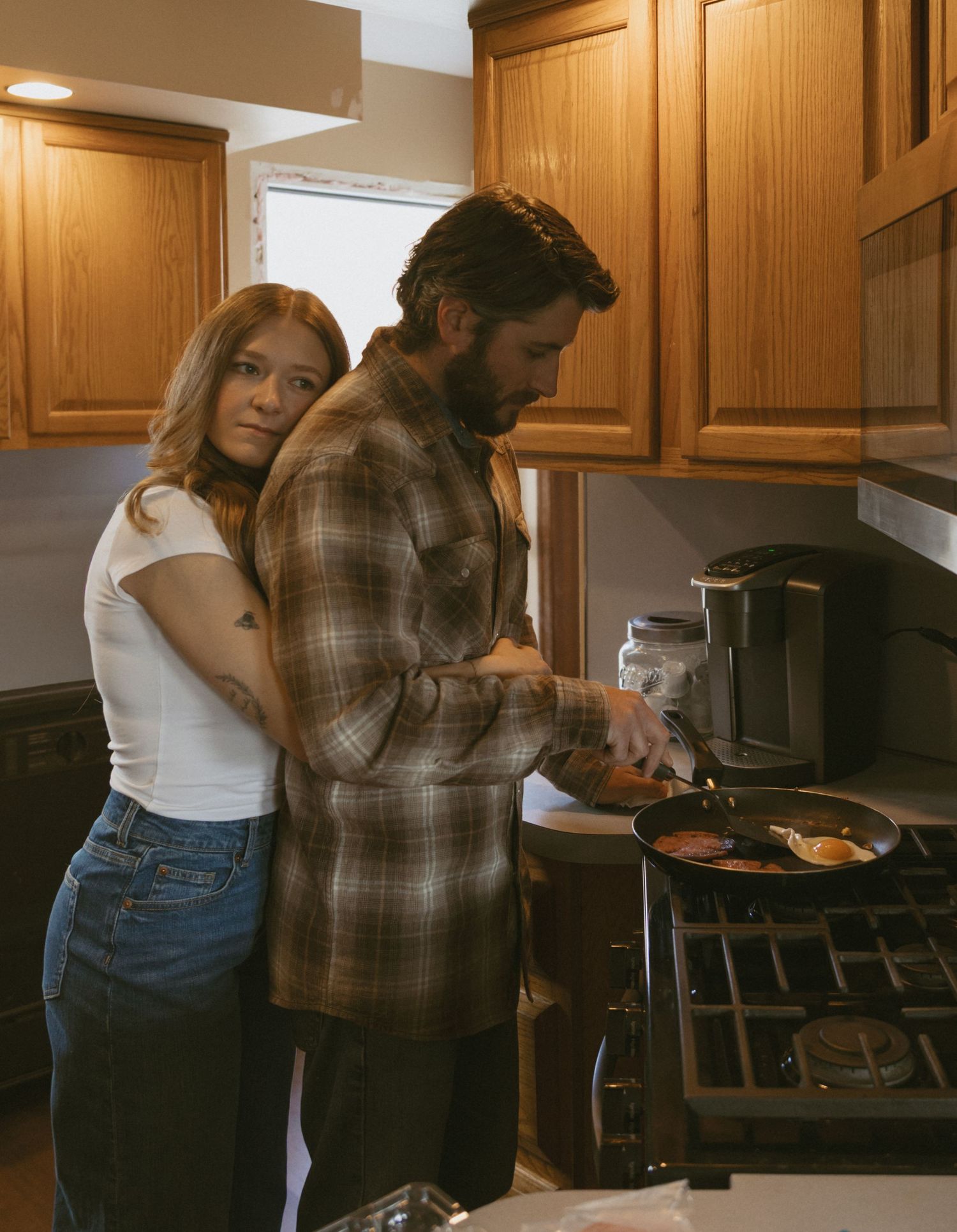 Cinematic and documentary in-home couple photo of cooking in the kitchen in the Catskill Mountains of New York