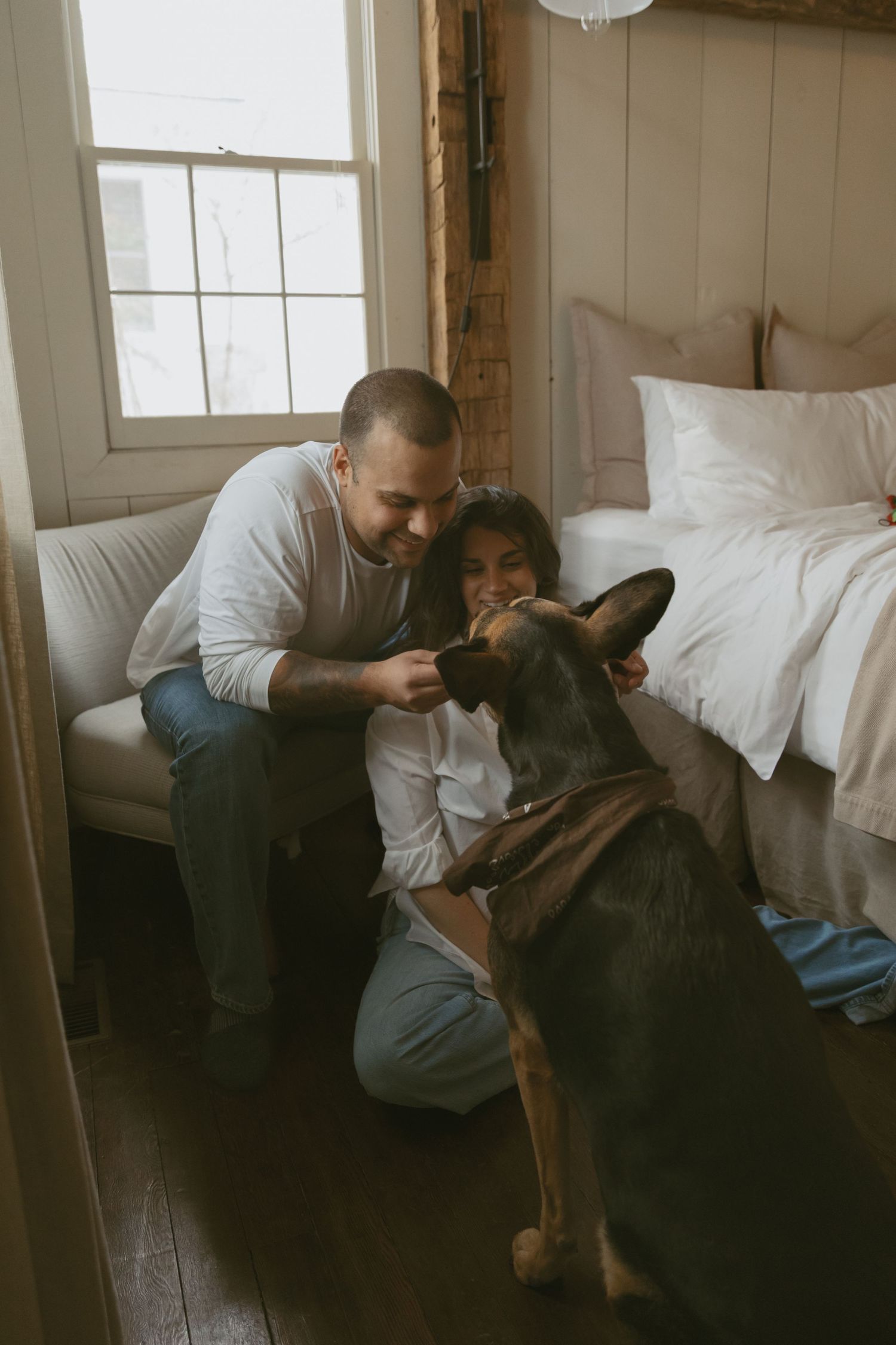 Cozy Editorial indoor maternity photos in the sleepy pine cottage at Cedar Lake Estates in Port Jervis, New York. Photo with dog near window