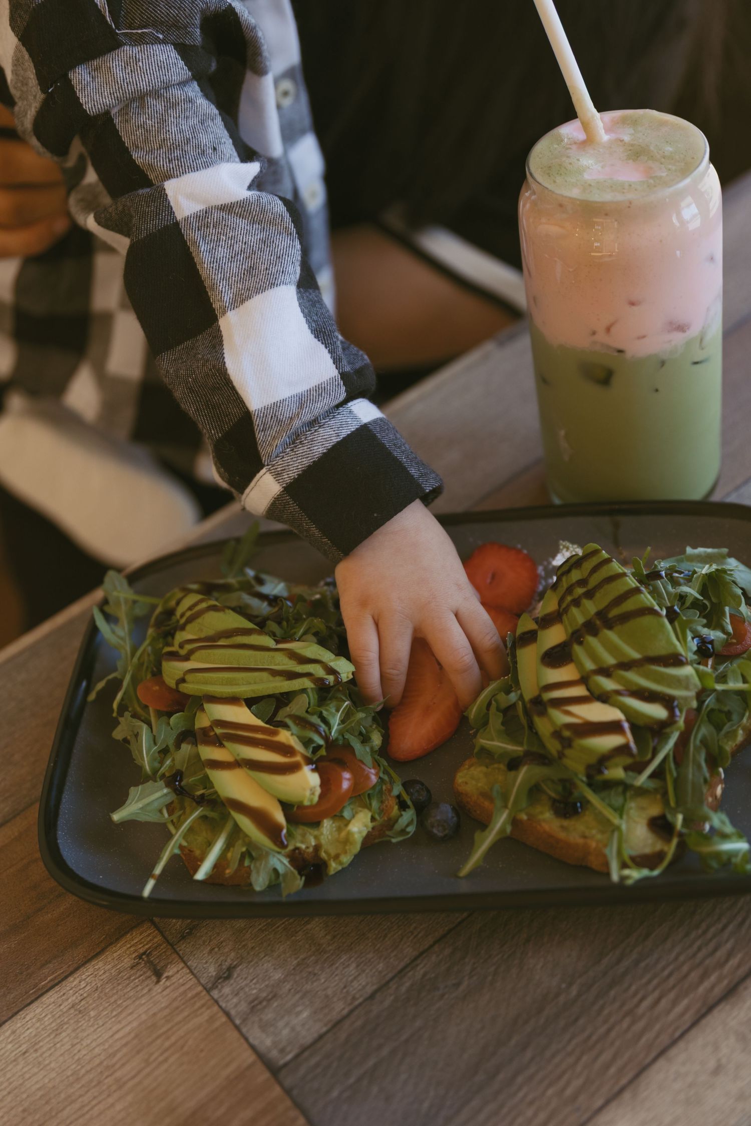 A family photoshoot. Candid shot of a toddlers hands in food.