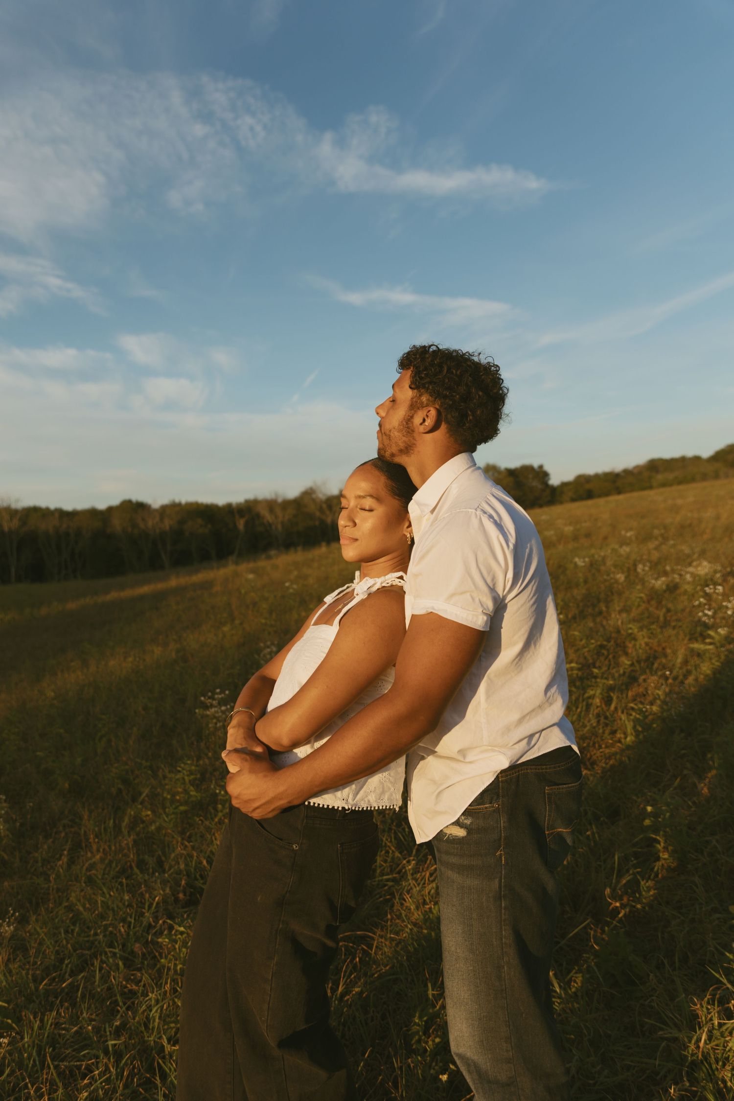Cinematic Couple photo in a field during golden hour in Sussex County New Jersey