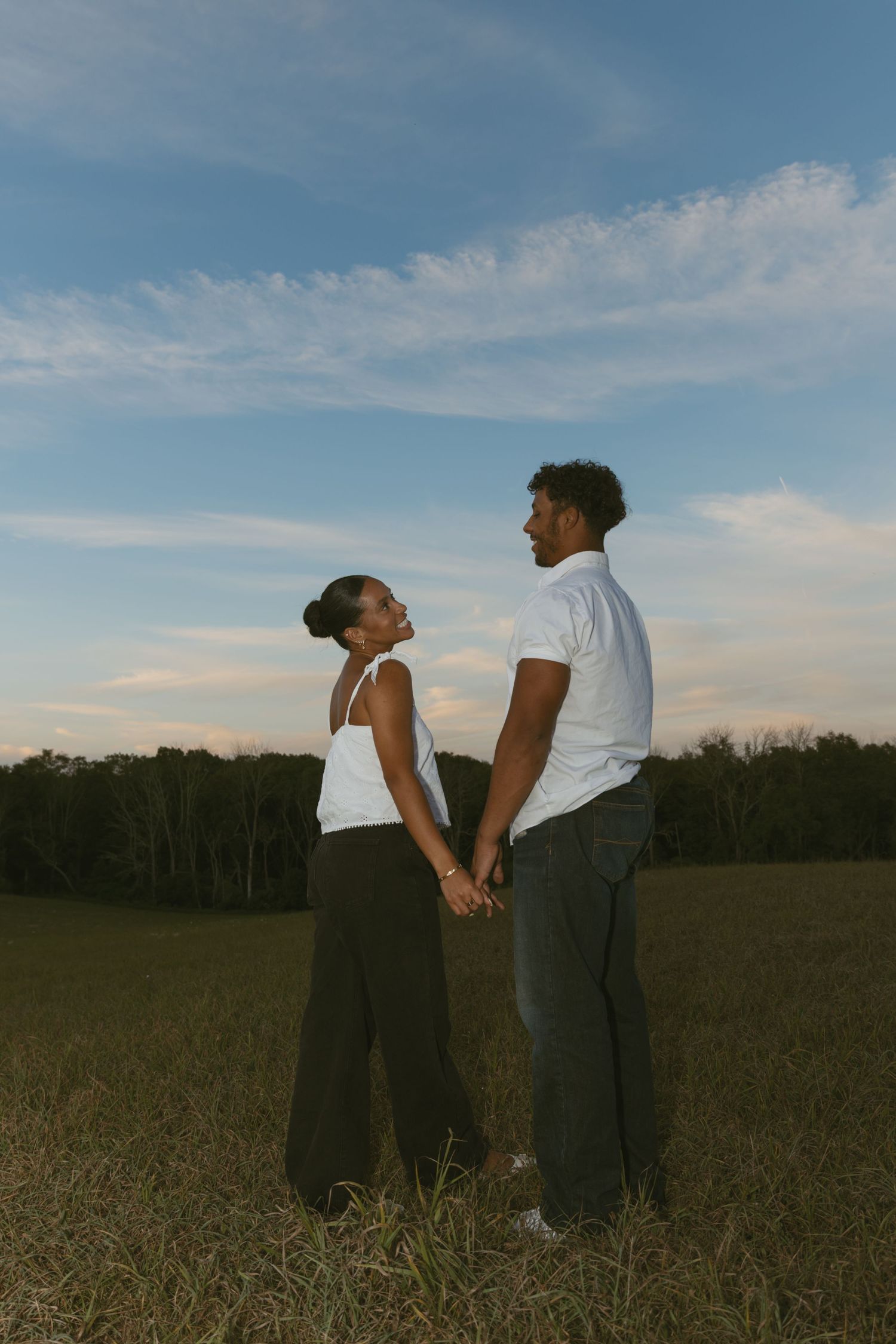 Cinematic Couple photo in a field during blue hour in Sussex County New Jersey
