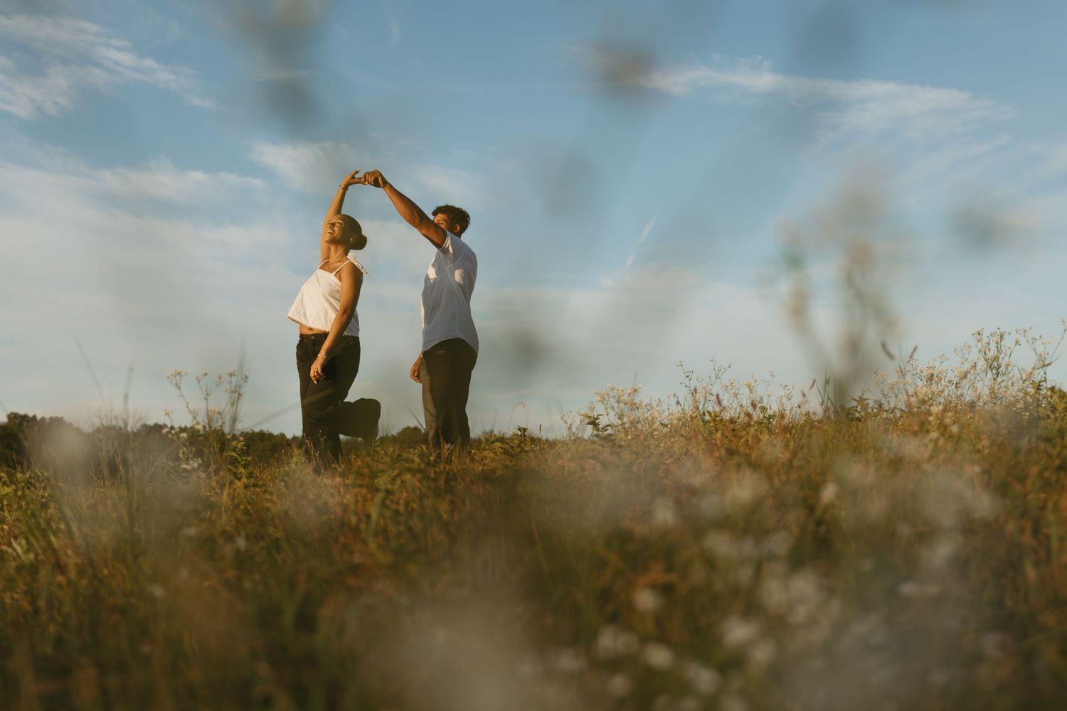 Cinematic Couple photo in a field during golden hour in Sussex County New Jersey