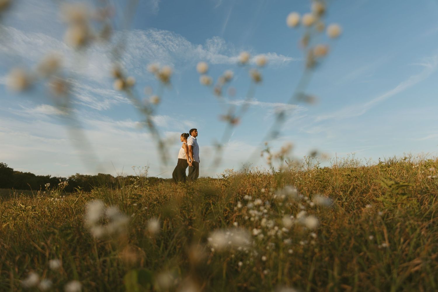 Cinematic Couple photo in a field during golden hour in Sussex County New Jersey