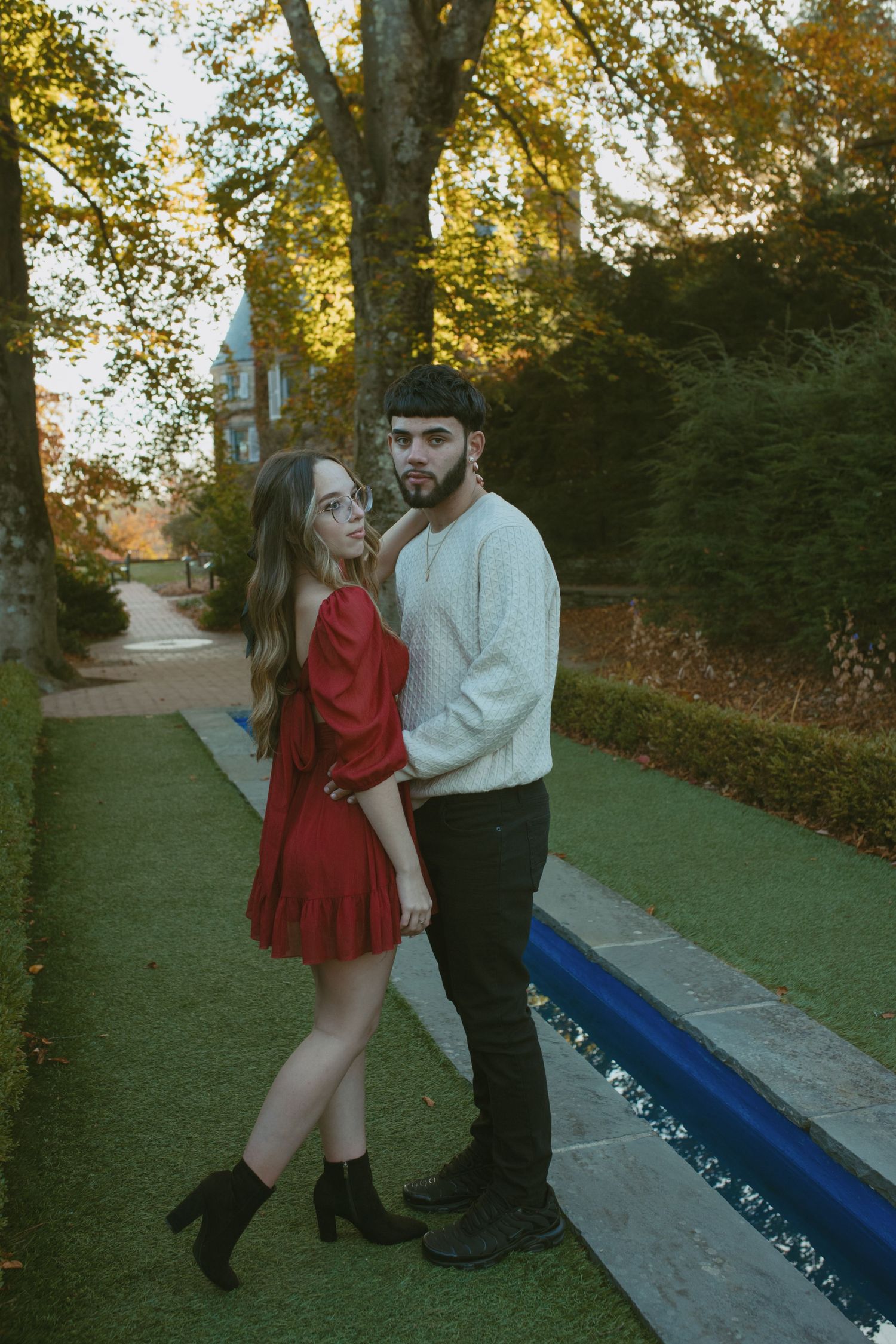Couples photos under fall foliage at Grey Towers, located in Milford, Pennsylvania