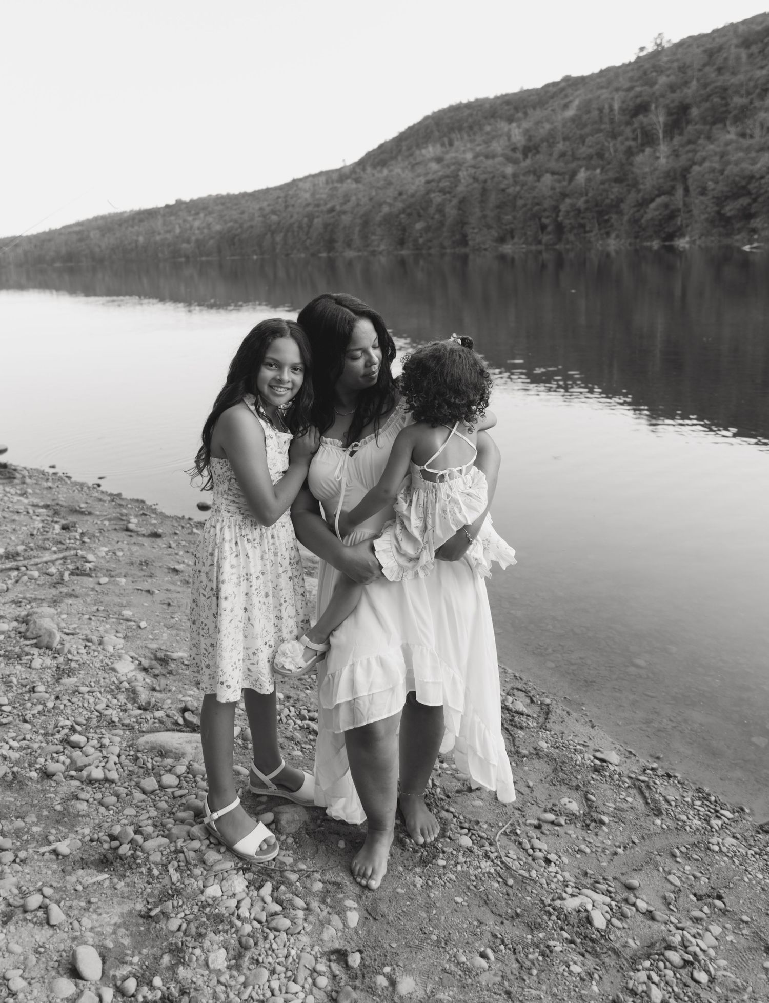 Family photos in Sullivan County New York, Catskills Mountains. Mom holding her toddler and hugging her daughter
