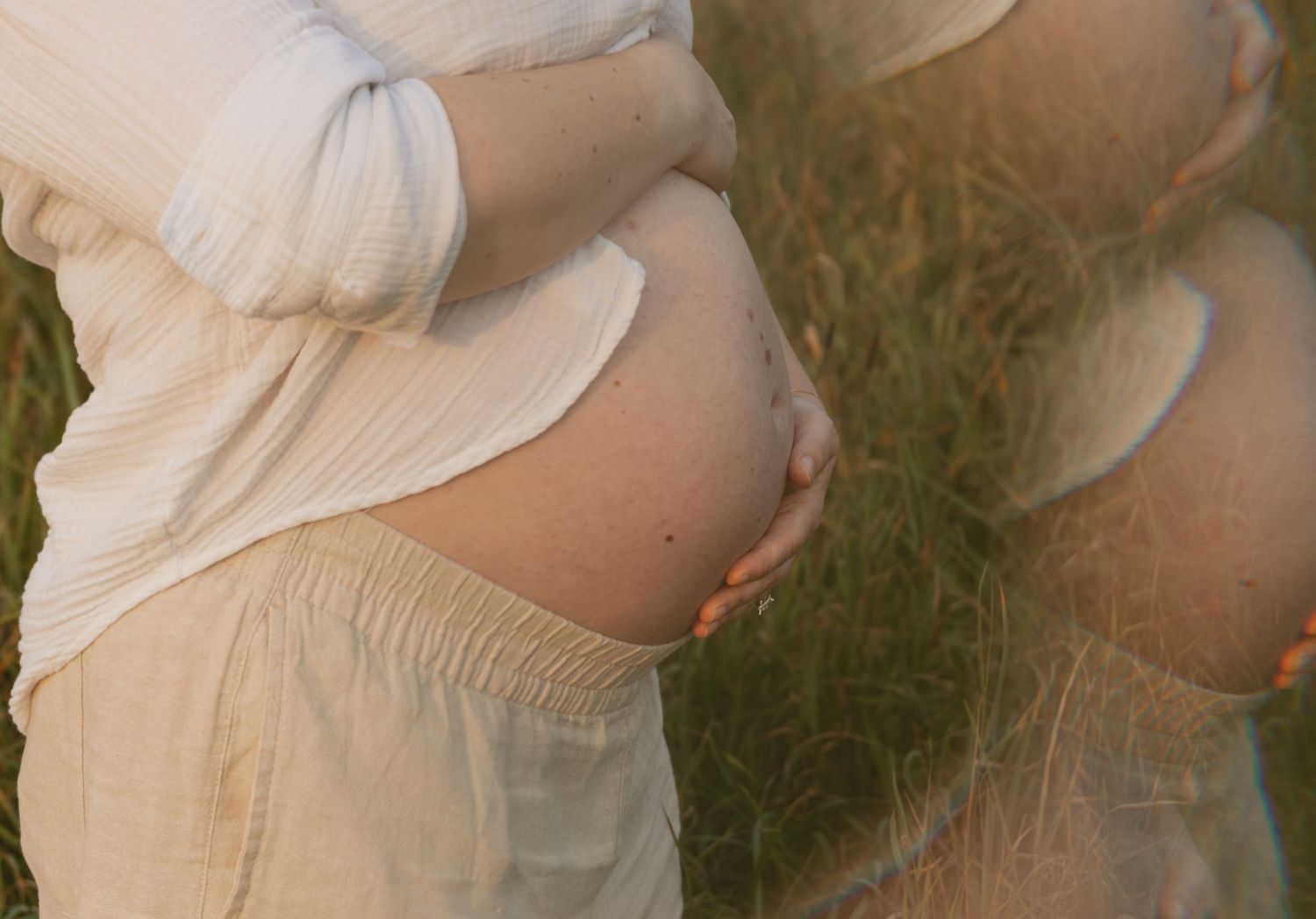 cinematic golden hour maternity photos in a field at sunset in Hudson Valley New York