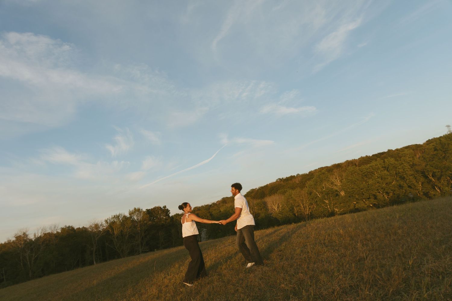 Cinematic Couple photo in a field during golden hour in Sussex County New Jersey