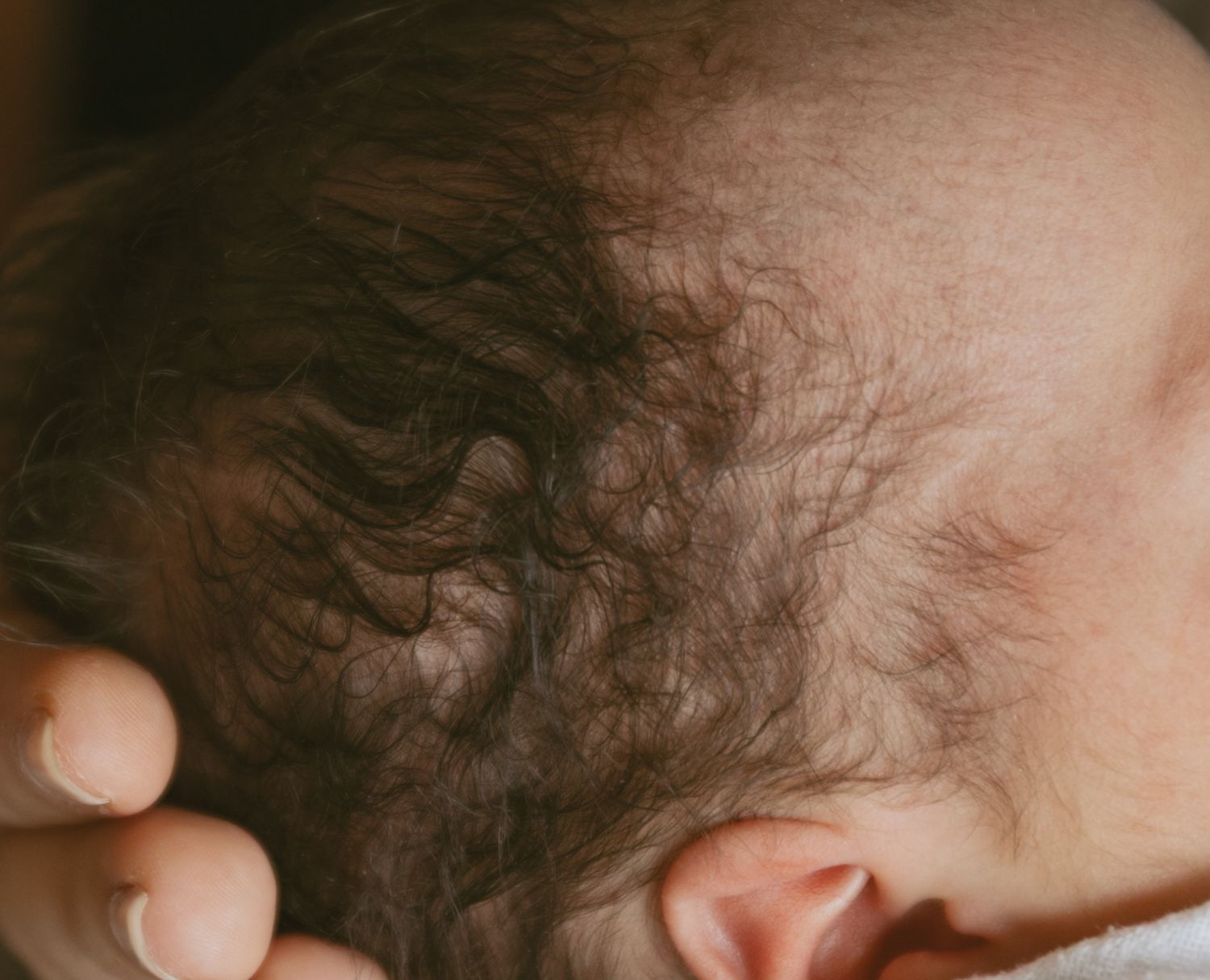 Indoor Newborn home session in Middletown, New York. Details of newborn baby hair