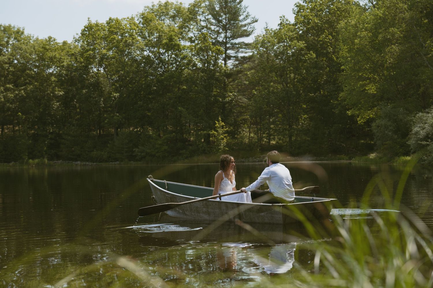 Documentary and Cinematic Couple photo of a couple in a boat in a pond in the Catskill Mountains of New York