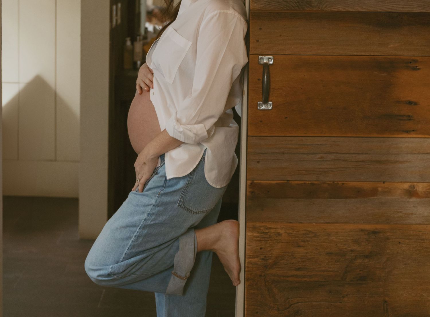 Editorial indoor maternity photos in the sleepy pine cottage at Cedar Lake Estates in Port Jervis, New York
