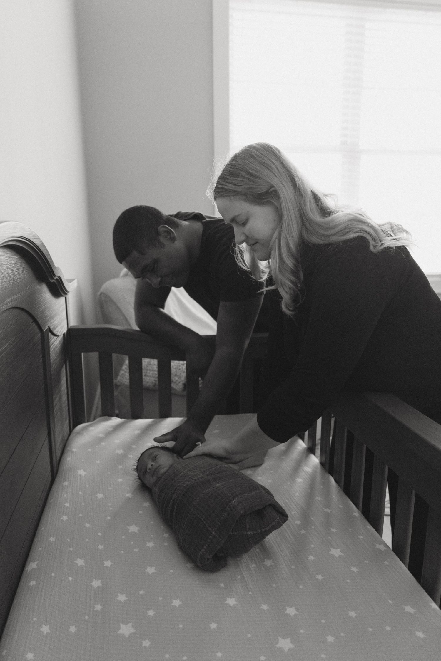 Newborn in-home photo in Catskill Mountains, New York. Emotional imagery, candid details of newborn baby in nursery as he is welcomed home.