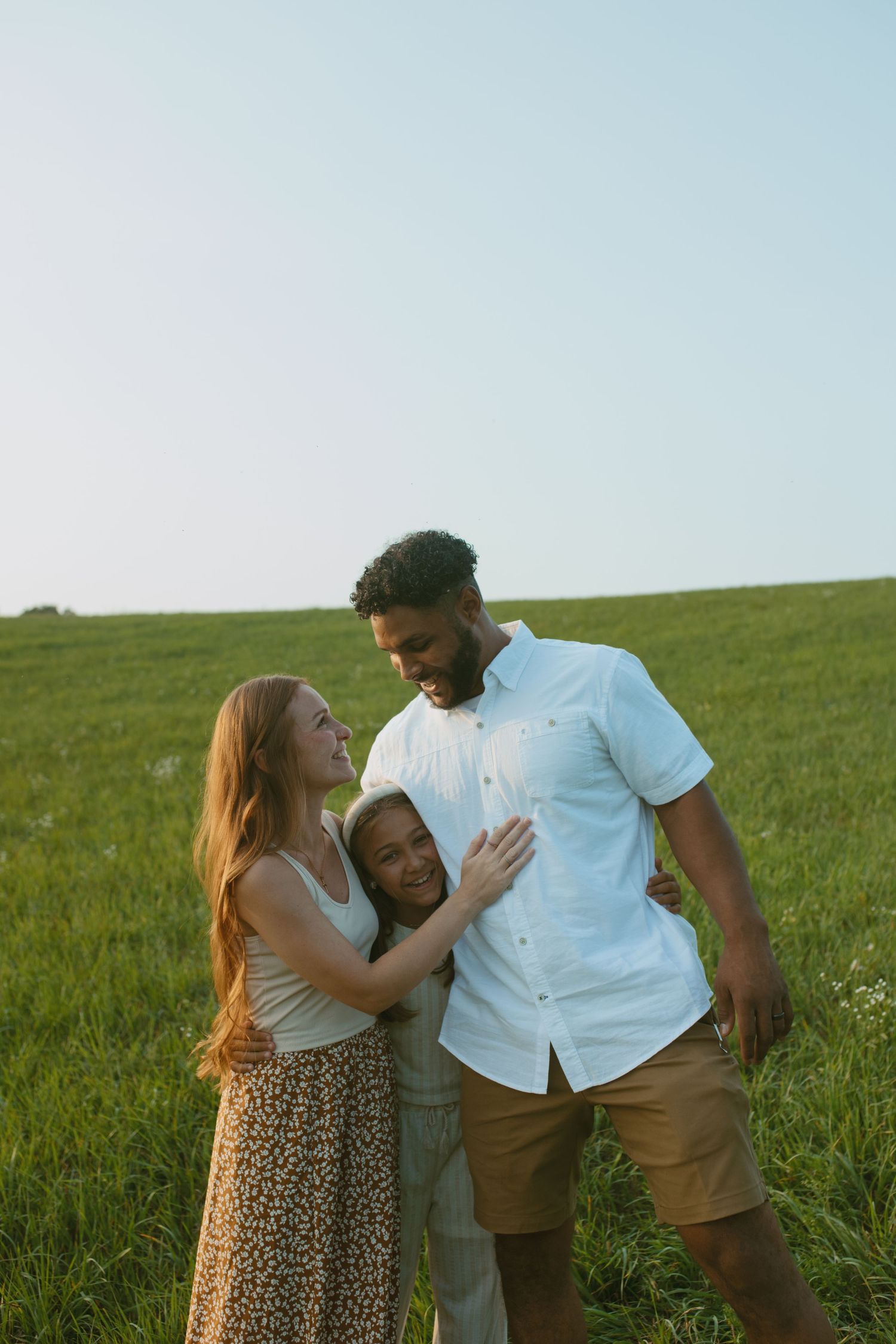 Port Jervis, New York Family Photographer capturing family photos in a field having a picnic.