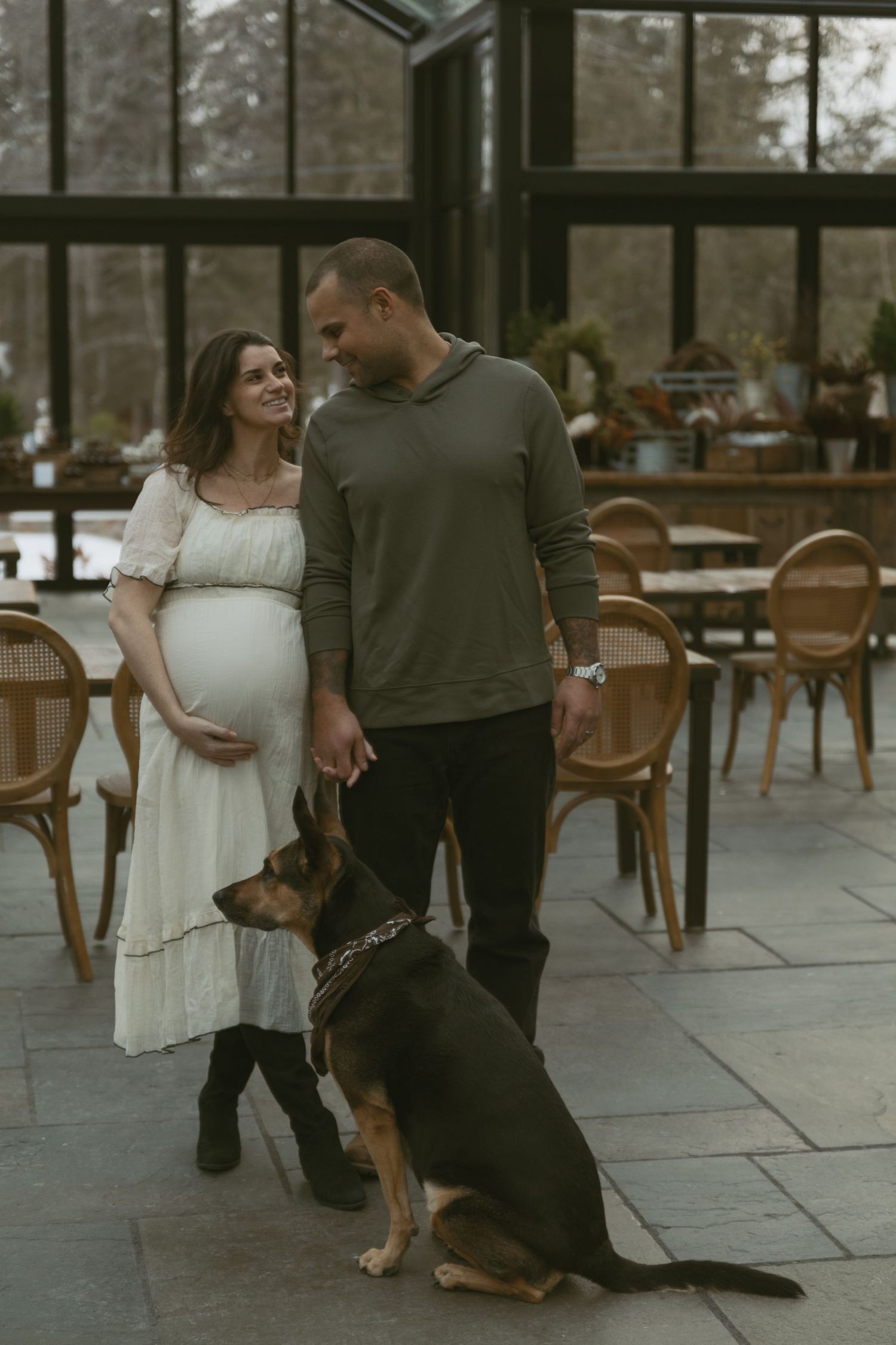 Cozy Editorial indoor maternity photos in the Glasshouse at Cedar Lake Estates in Port Jervis, New York. Mom, dad and dog.