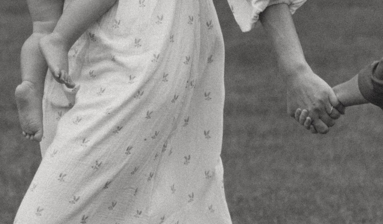Family Photo Session near Milford, Pennsylvania in a field. Documentary motherhood moment of mom with a baby on her hip