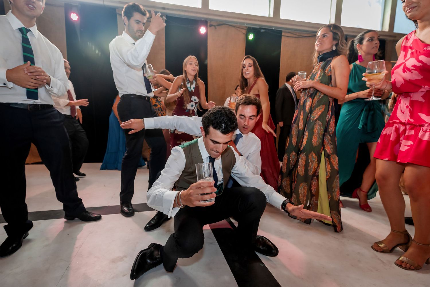Wedding guest shows off impressive dance moves on the reception dance floor.
