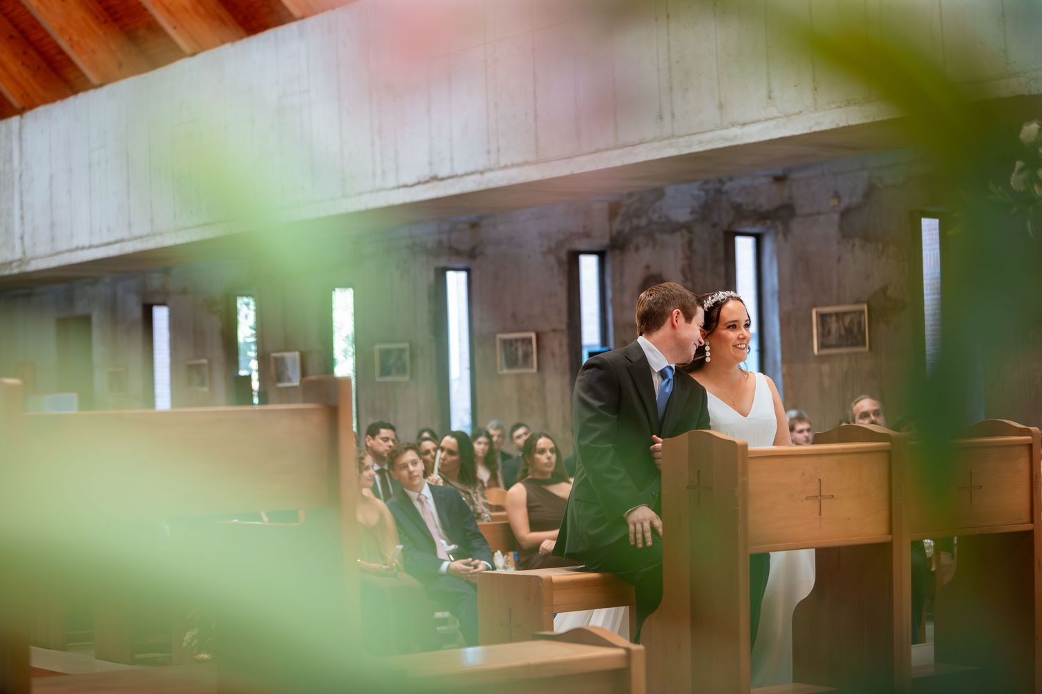 Bride and groom share an intimate moment at the altar during their church wedding ceremony.
