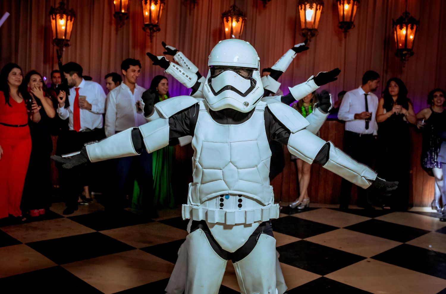 Star Wars Stormtrooper striking a dramatic pose on a black and white checkered dance floor.