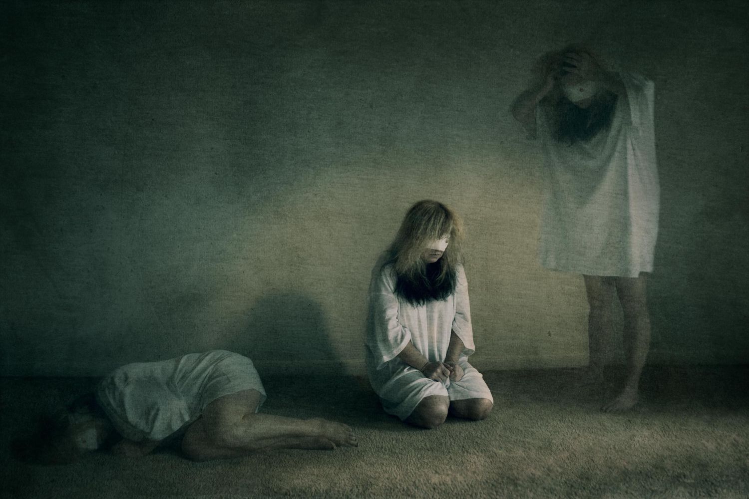 Three ghostly figures in white in a dark, eerie room, evoking horror and mystery in a cinematic scene.