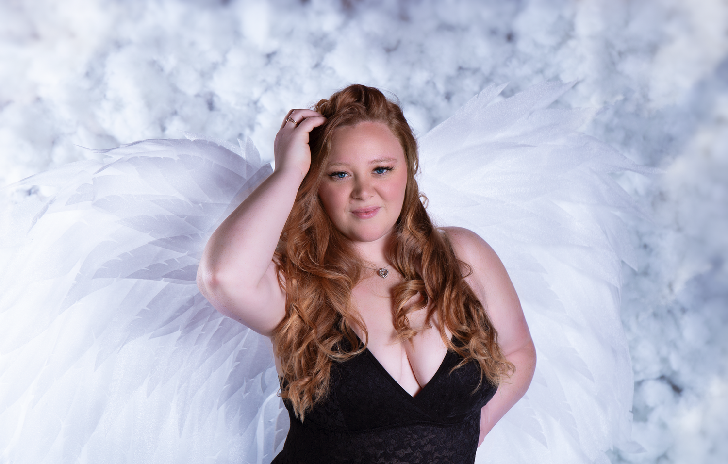 Elegant boudoir photography against white textured background.
