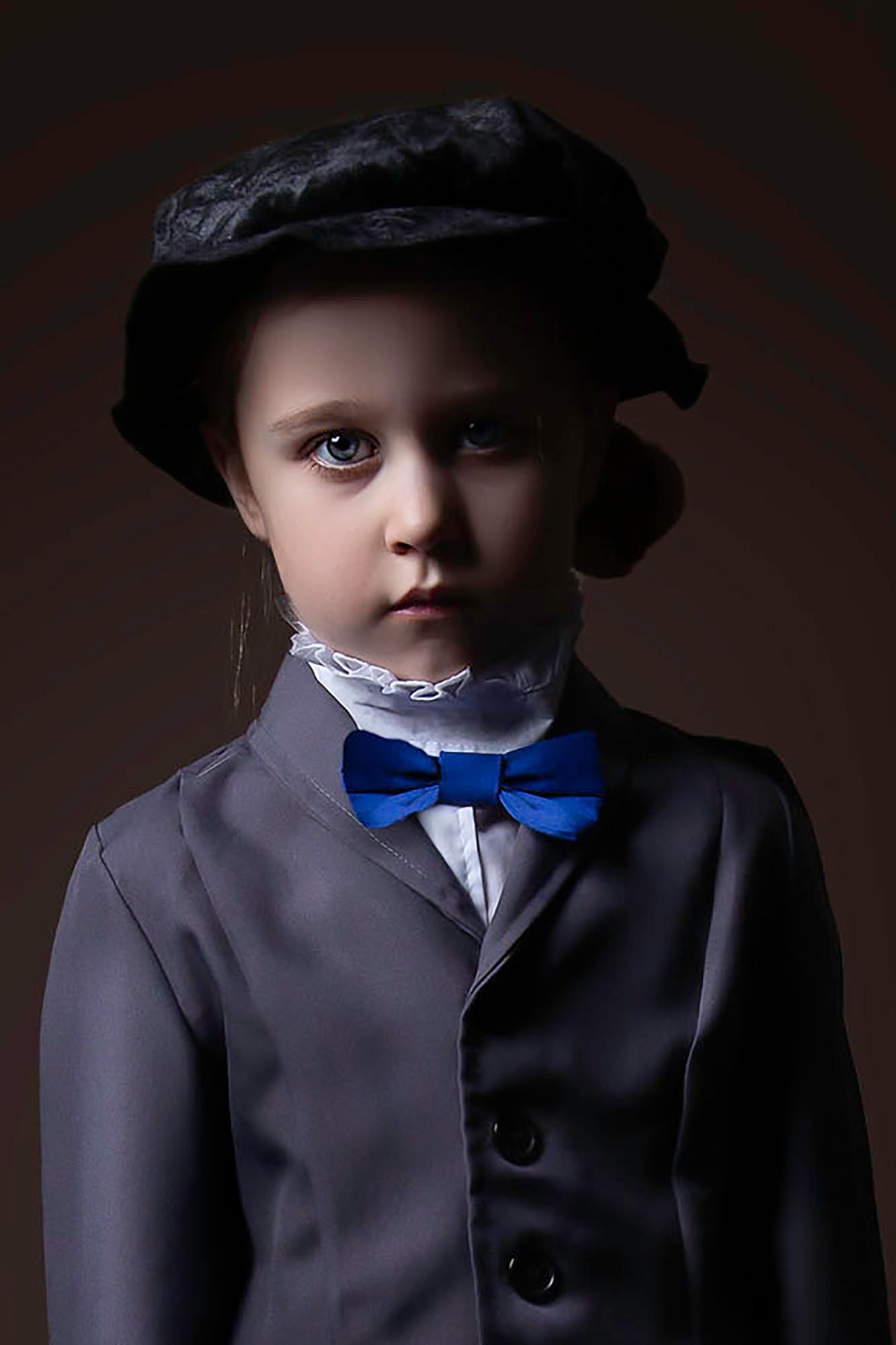 Dramatic portrait series featuring Victorian-style costume with blue bowtie against dark background.
