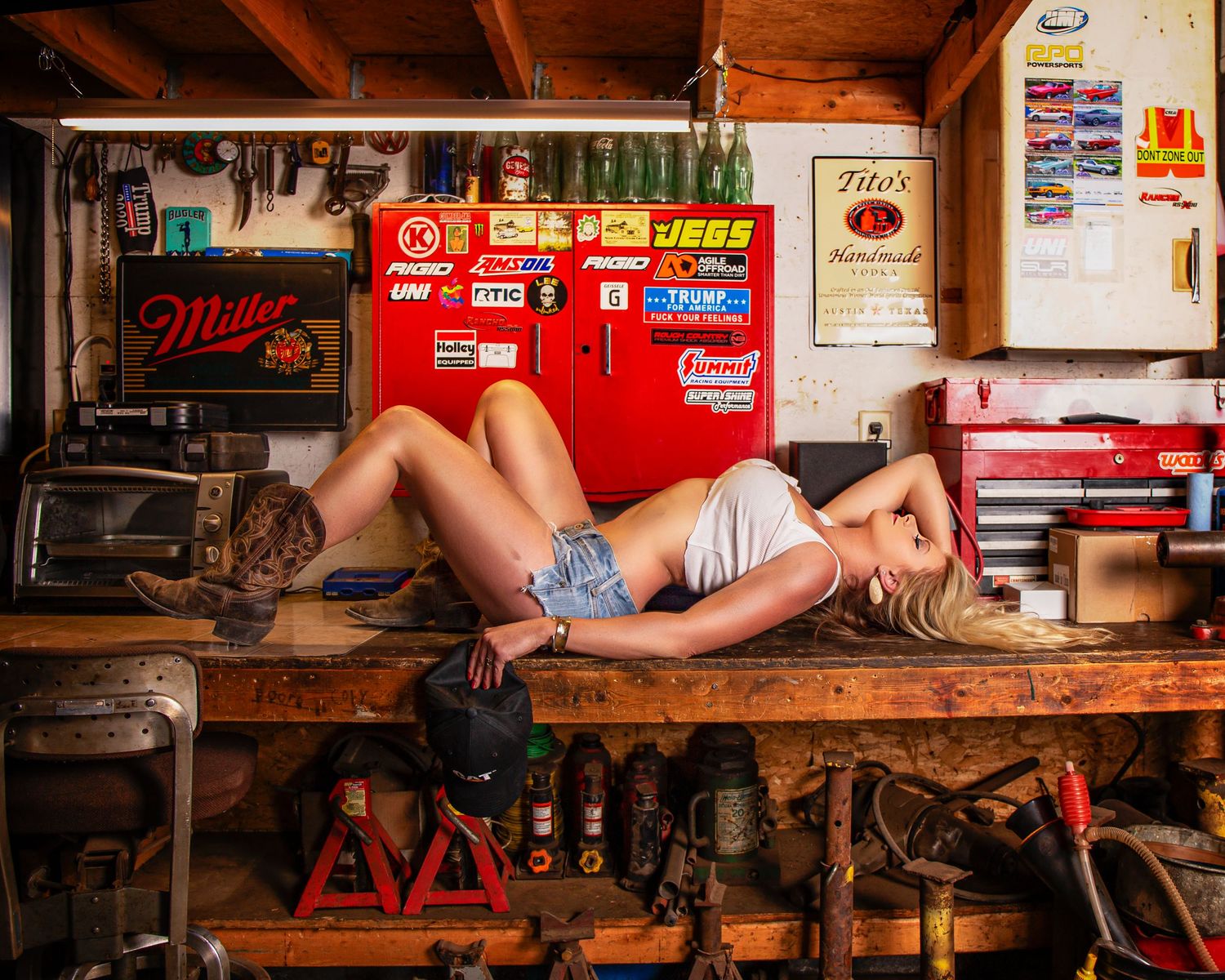 Retro garage setting with workbench and nostalgic automotive memorabilia.
