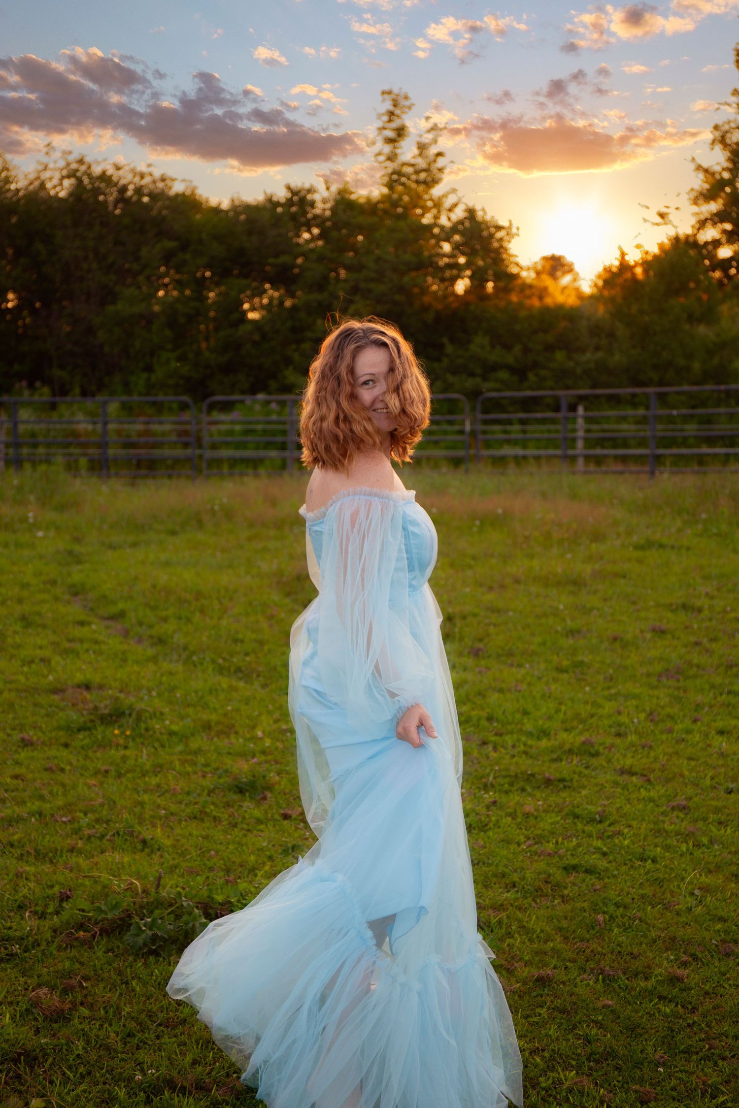 Ethereal scene of a flowing white dress twirling in a sunlit meadow at golden hour.