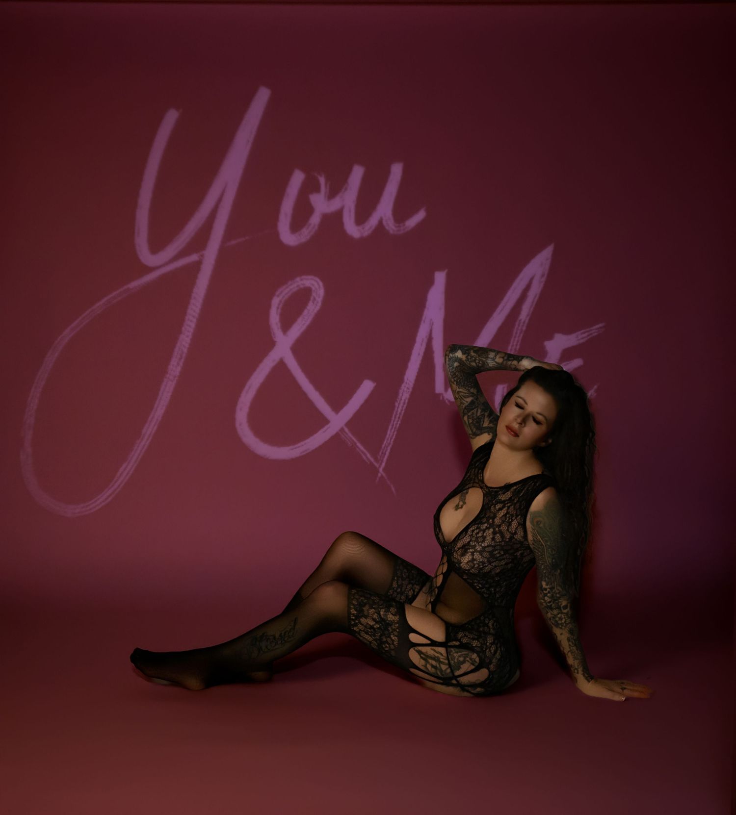 Artistic boudoir photo series with dark purple lighting and silhouettes against wall projections.