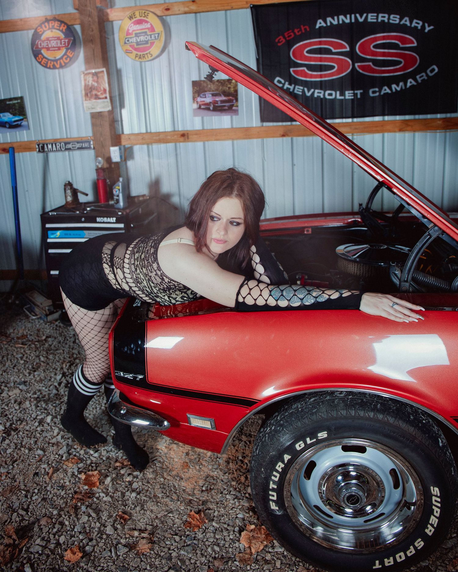 Vintage car photoshoot featuring classic red Chevrolet SS with retro styling.
