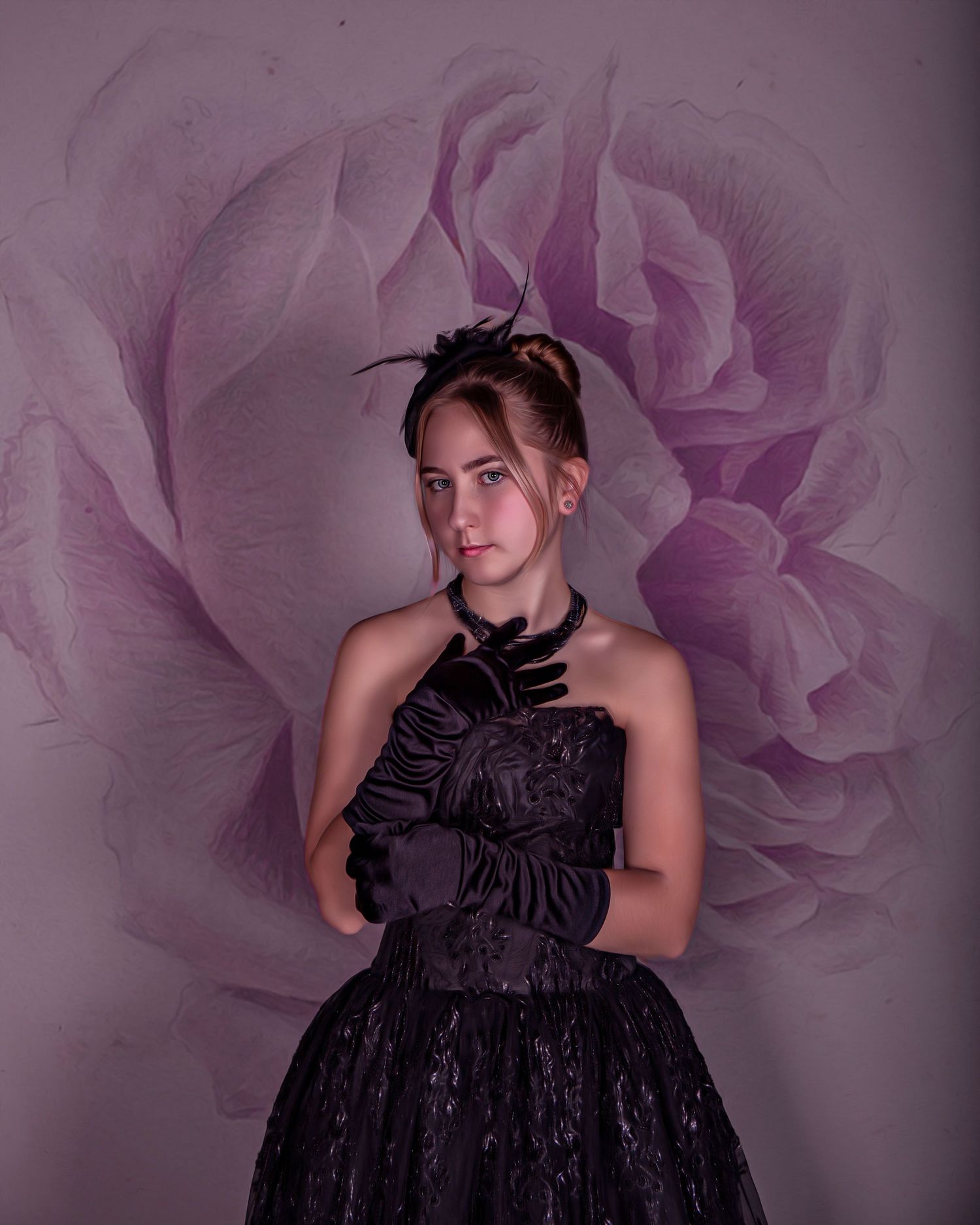 Black dress fashion photography against a soft pink floral backdrop.