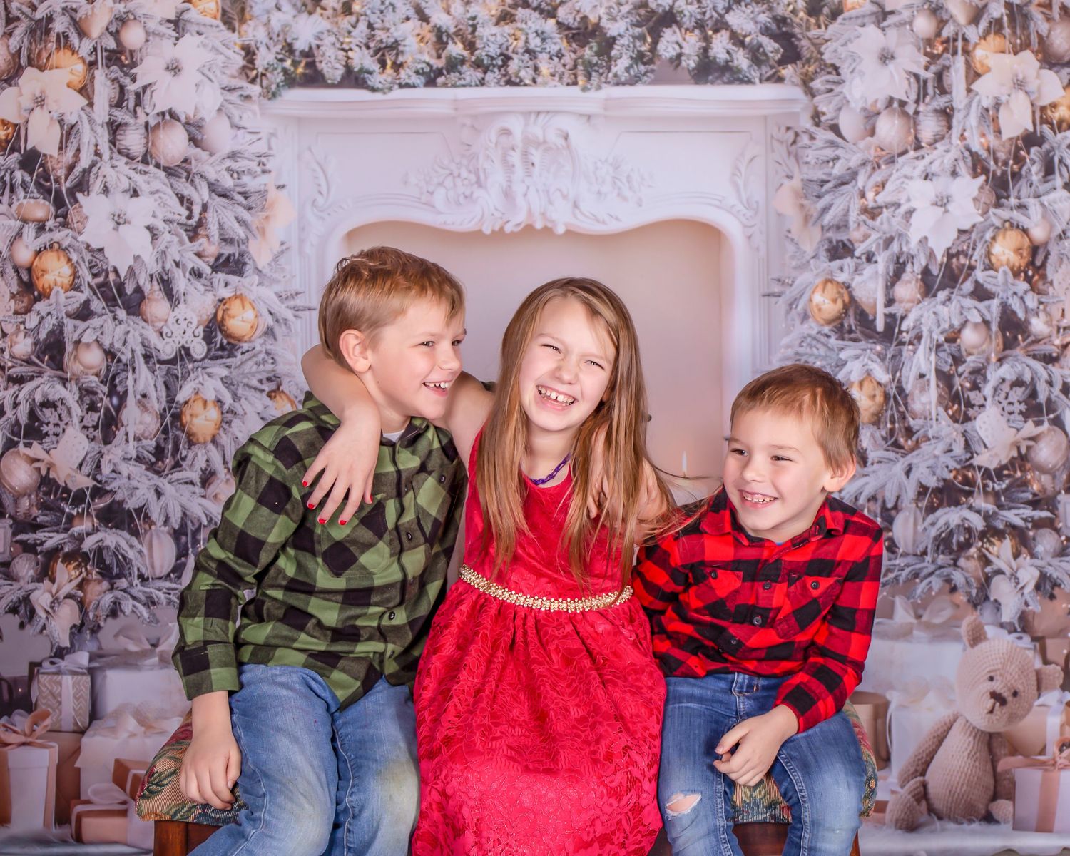 Festive holiday portrait session with Christmas decorations and plaid outfits.