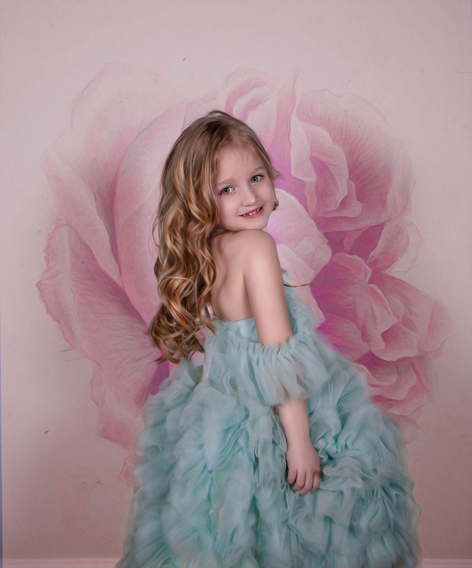 Dreamy portrait session with a mint green tulle dress against a pink floral background.